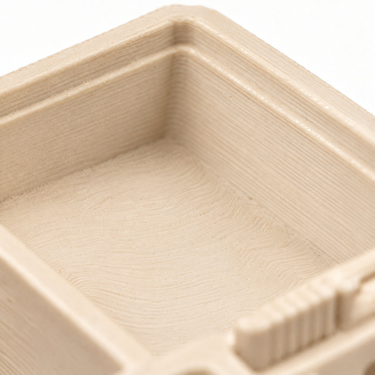 Detalle de las líneas de impresión 3D del Forrajeo Mini 3D en crema